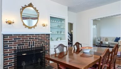 A Dining Room Table in Front of a Cozy Fireplace
