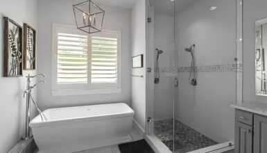 Monochromatic Bathroom With Freestanding Tub Next to Shower