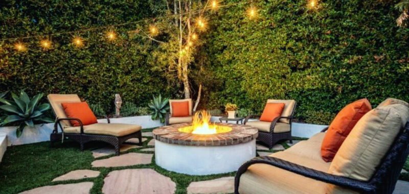 Chic Patio With Round Fire Pit And String Lighting