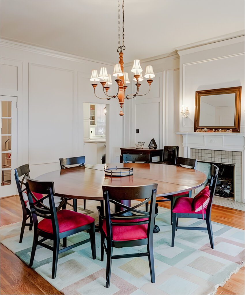 Classic Dining Room Design With Round Table And Red Chairs