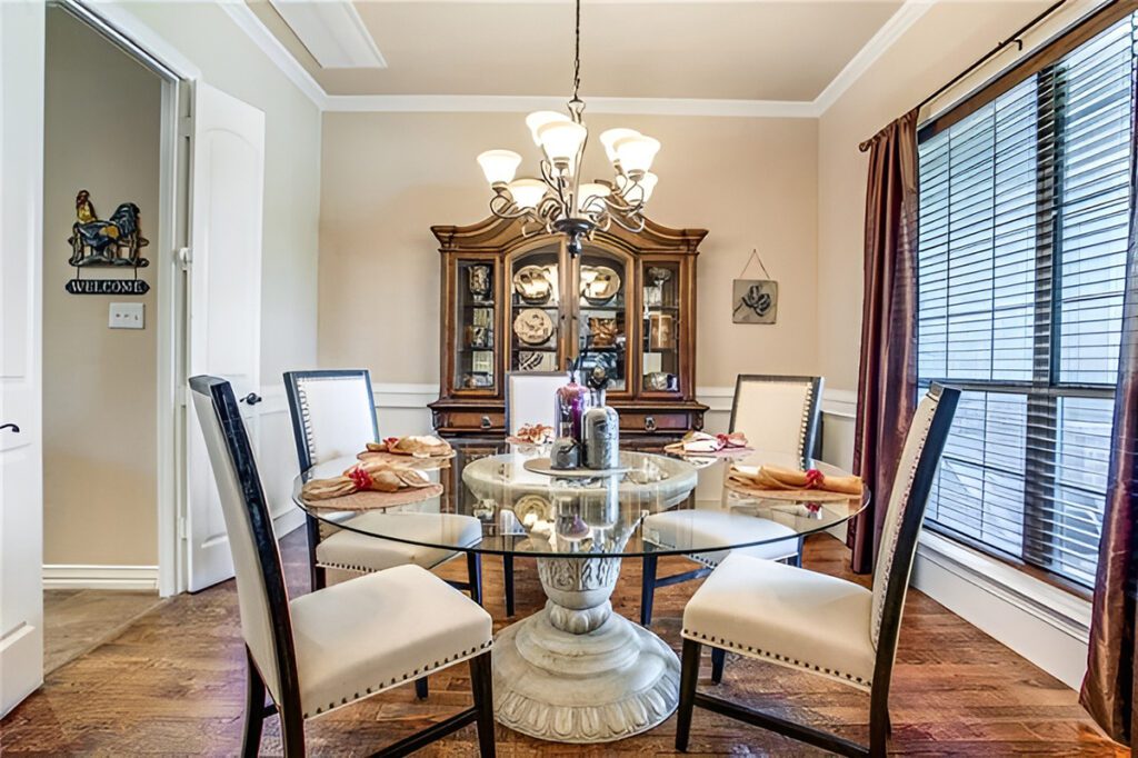 Classic Dining Room With Sleek and Modern Round Glass Table