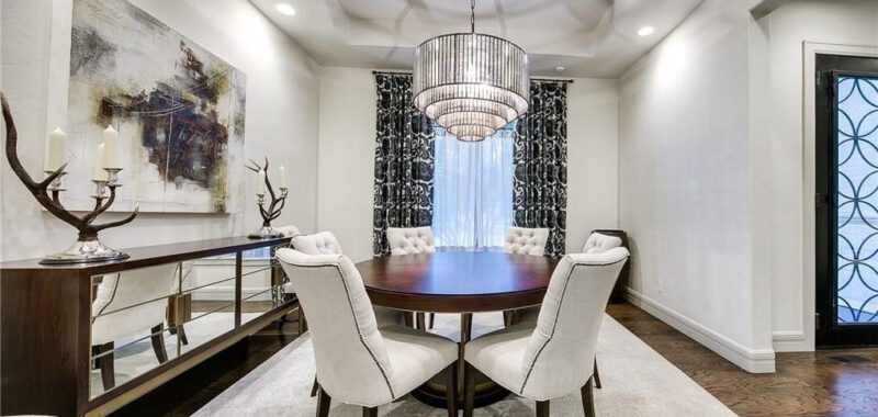 Contemporary White Dining Room With Round Dark Wood Table