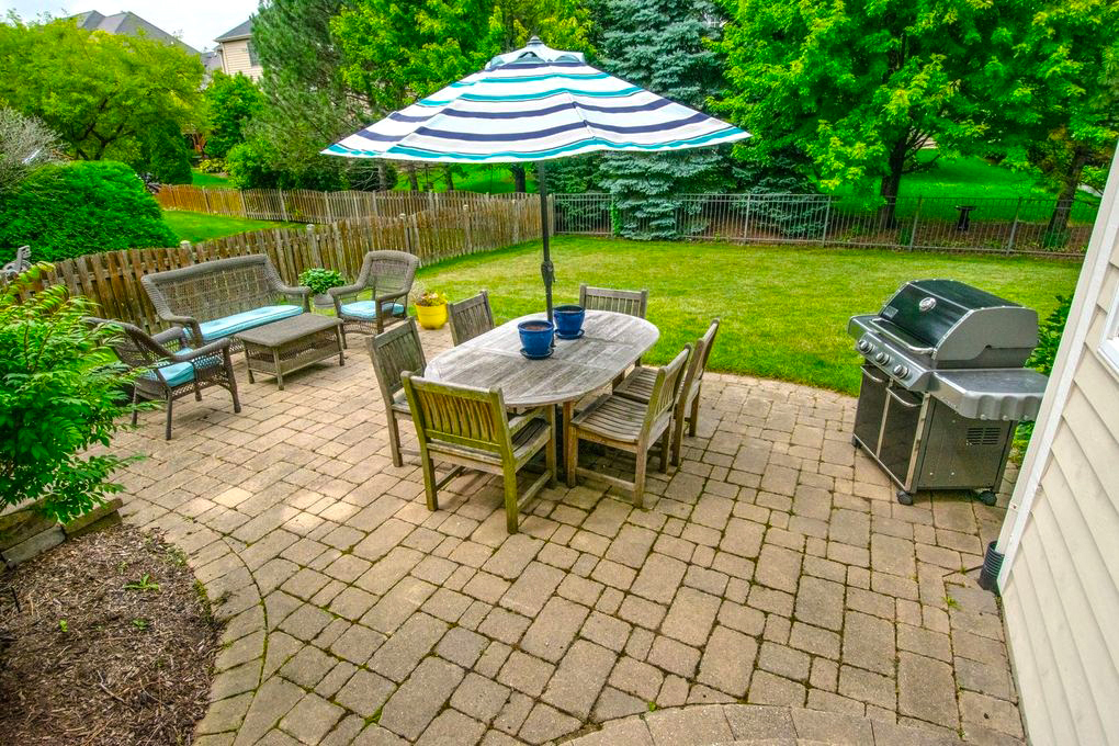 Cozy Suburban Patio with Paver Design for Easy Outdoor Living