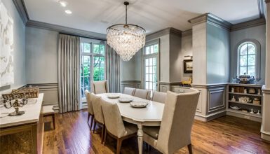 Dining Room With Rectangular Table And Crystal Chandeliers