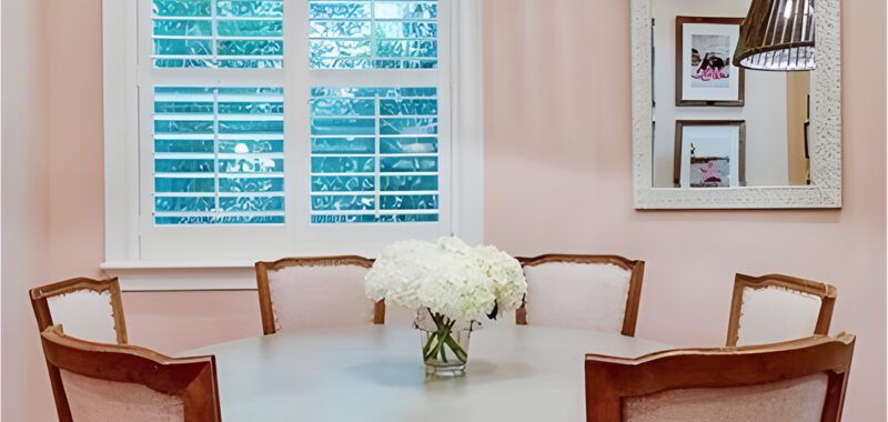 Dining Room With White Round Table And Oversized Pendant Lamp