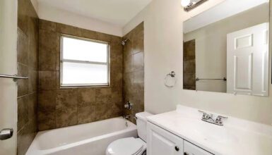 Modern Minimalist Bathroom Design with Tile Tub Surrounds