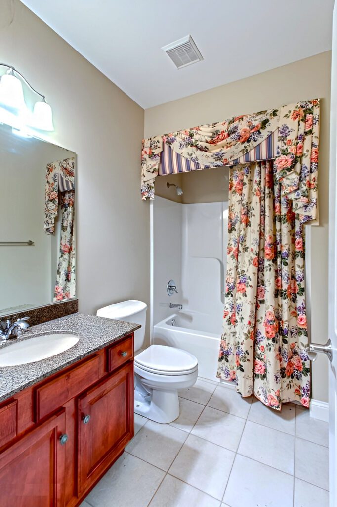 Small Bathroom with Bold Floral Shower Curtains