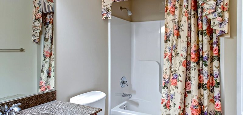 Small Bathroom with Bold Floral Shower Curtains
