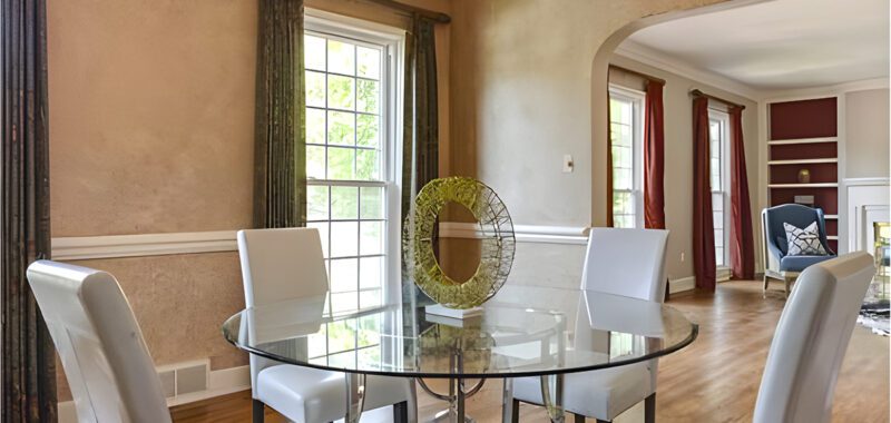 Traditional Dining Room With Modern Round Glass Table