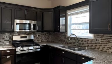 Black Kitchen Cabinets with Marble Countertops